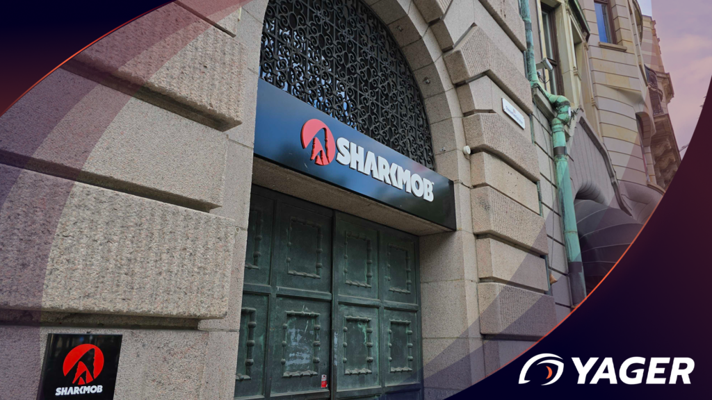 The Sharkmob office visible from the street with 2 signs saying Sharkmob and a big old verdegris double door.